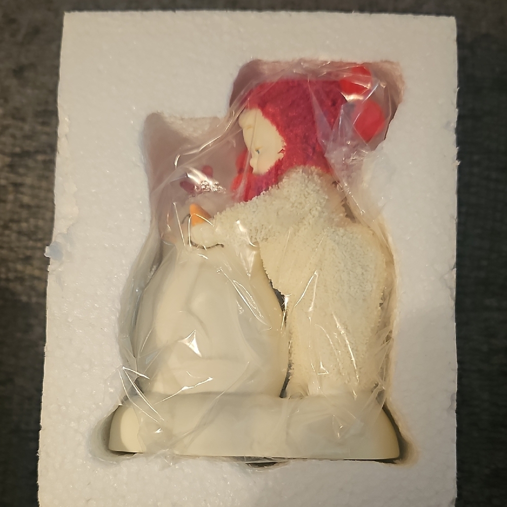 Adorable Figurine with Red Hat